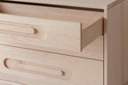 Caravan Dresser in ash with the top drawer fully pulled out, showing the dovetail joinery at the corner of the drawer box.