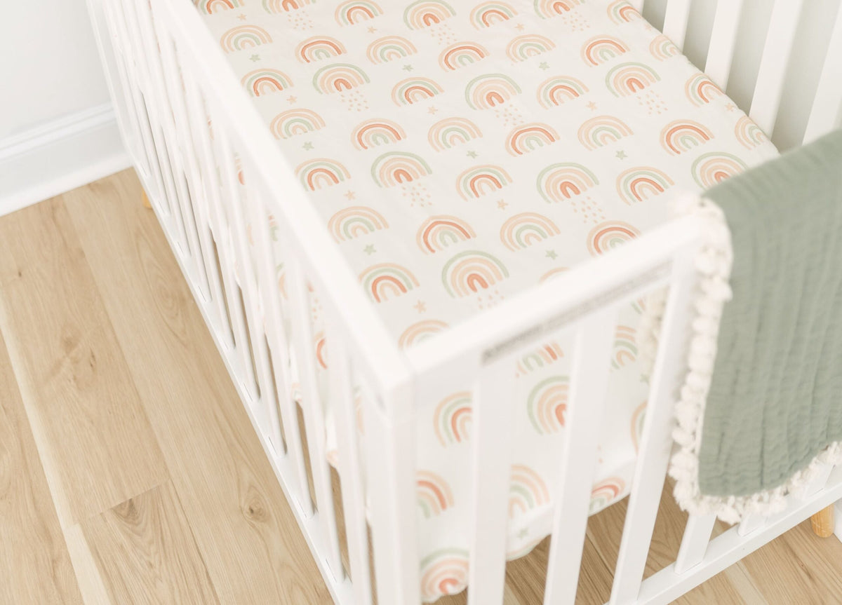 Crane Baby Parker Rainbow crib sheet in a nursery