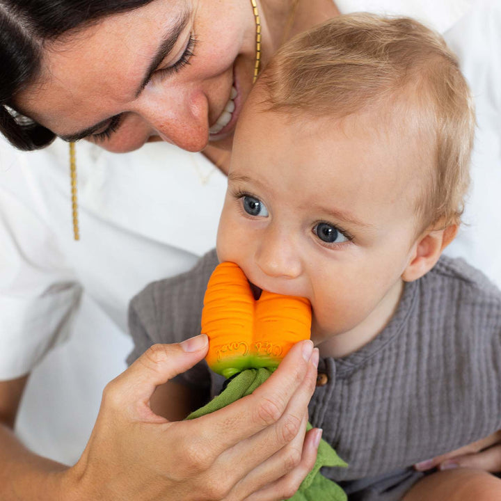 Oli & Carol natural rubber teether in use