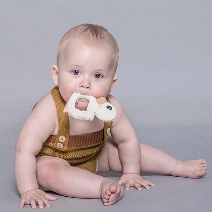 Baby chewing a Hevea natural rubber teether