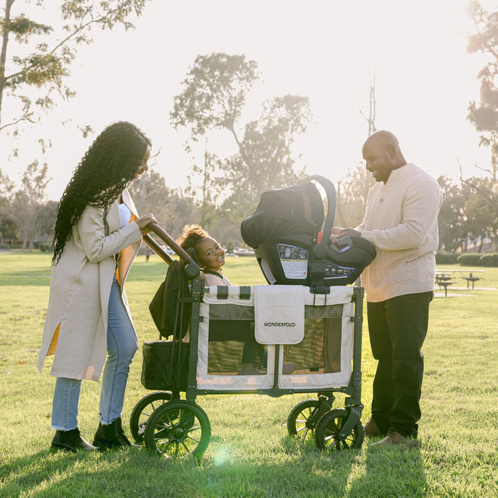 WONDERFOLD — mom and dad with car seat wagon