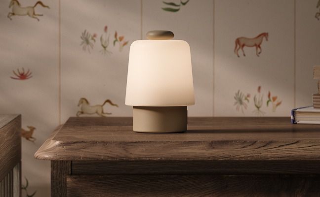 Hatch Baby sound machine and night light on a nursery dresser