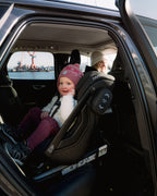 Child riding rear-facing in the Axkid ONE 3