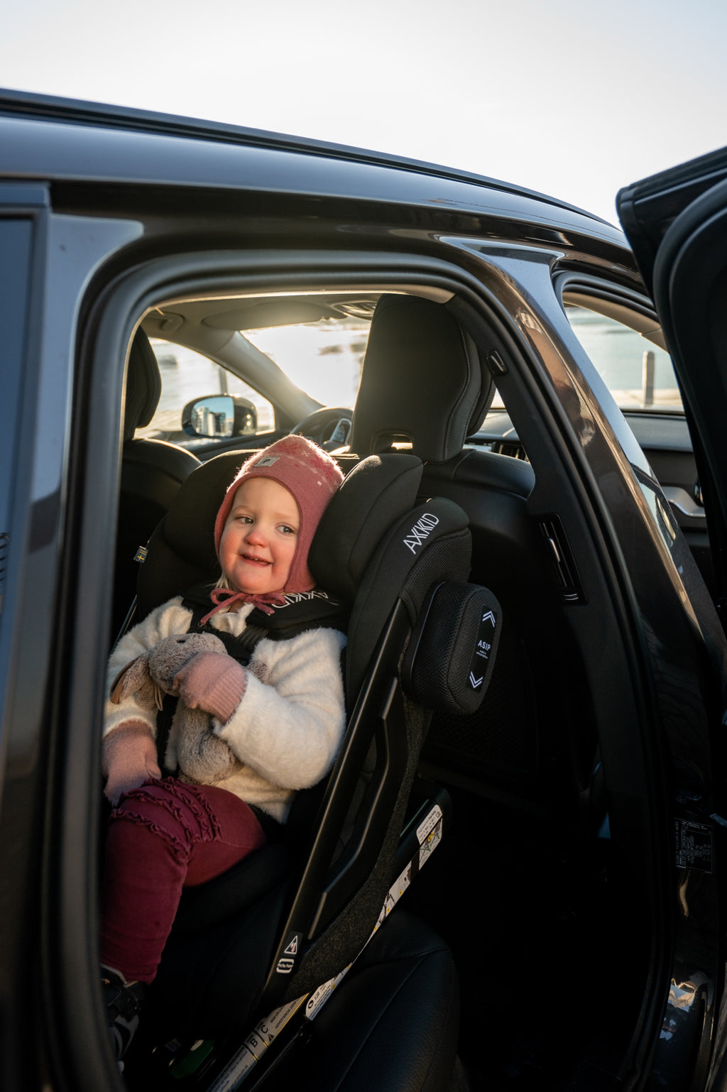 Child laughing in the Axkid ONE 3