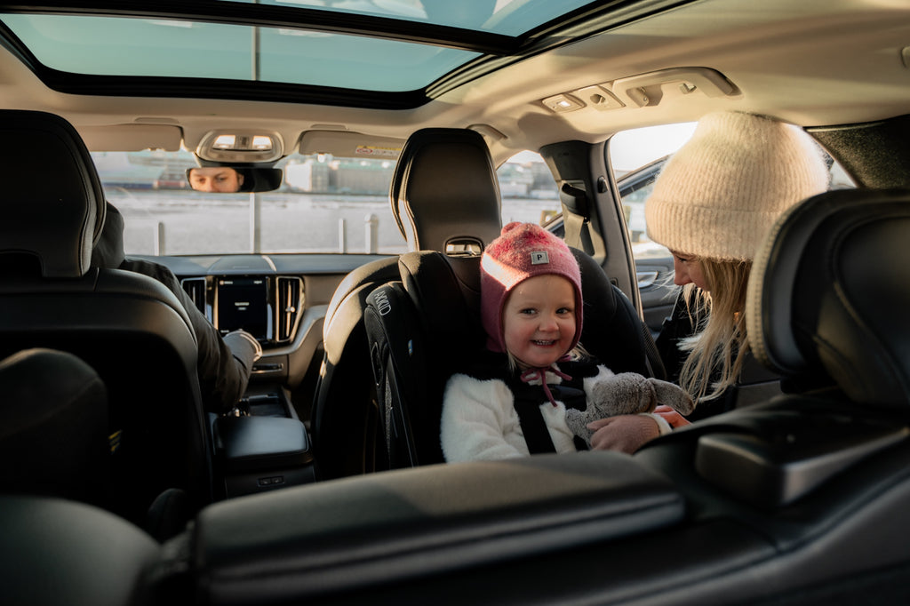 Child rear-facing in the Axkid ONE 3 on a family drive