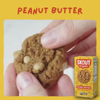 Skout Organic Peanut Butter Soft Baked Cookies - Close-up of a Peanut Butter Soft-Baked Cookie being pulled apart to show its soft, chewy interior and peanut butter chips.