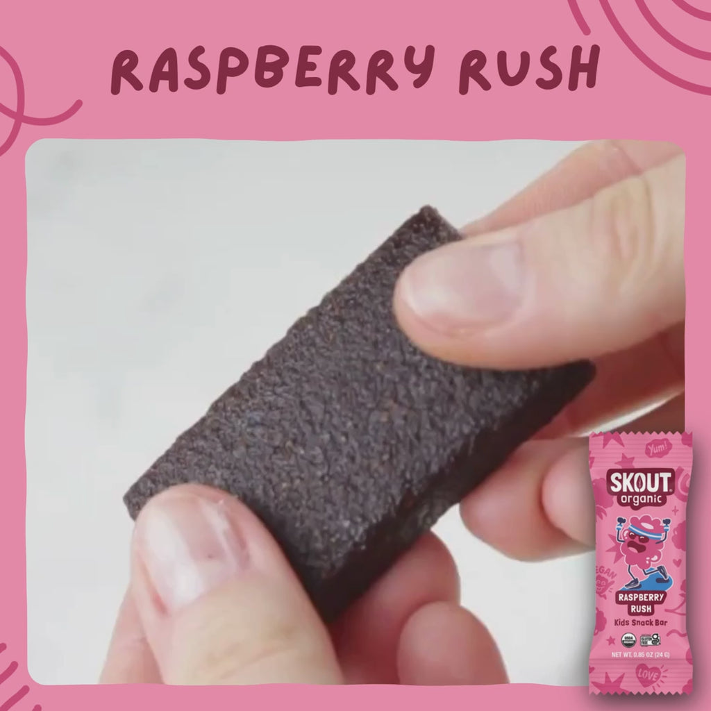 Skout Organic Kids Fruit Bar Variety Pack - Close-up of a Raspberry Rush Kids Snack Bar being pulled apart to show its soft, chewy interior.