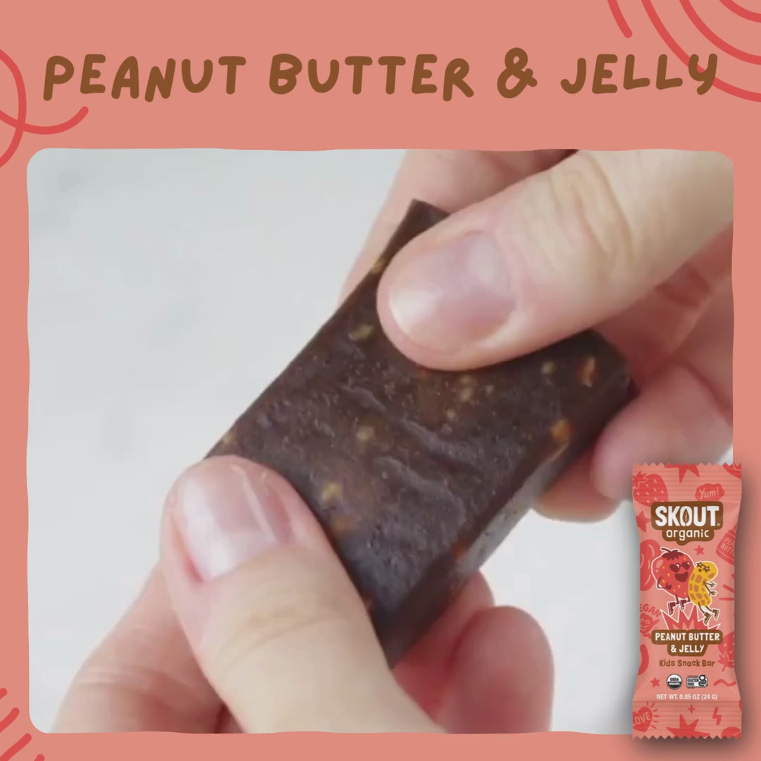 Skout Organic Peanut Butter & Jelly Kids Bar - Close-up of a Peanut Butter & Jelly Kids Snack Bar being pulled apart to show its soft, chewy interior with peanut pieces.