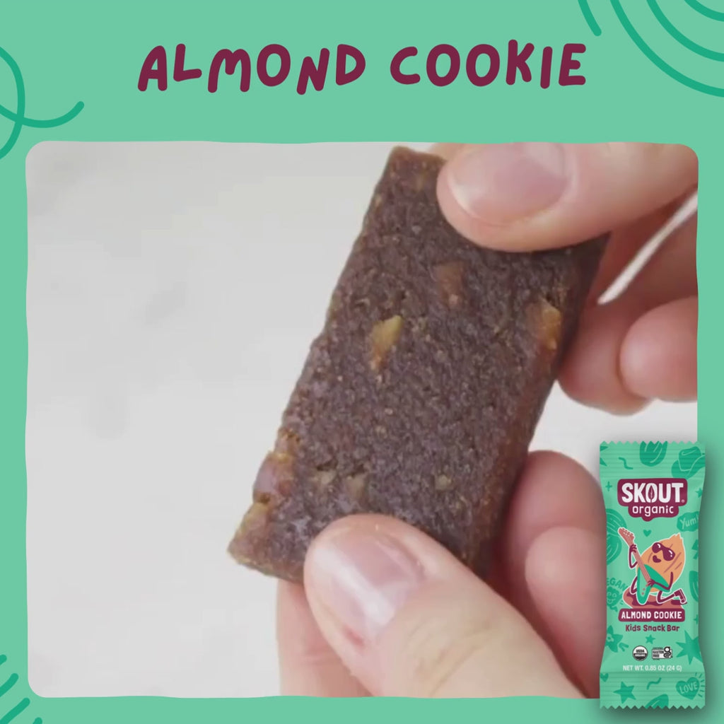 Skout Organic Almond Cookie Kids Bar - Close-up of an Almond Cookie Kids Snack Bar being pulled apart to show its soft, chewy interior with almond pieces.