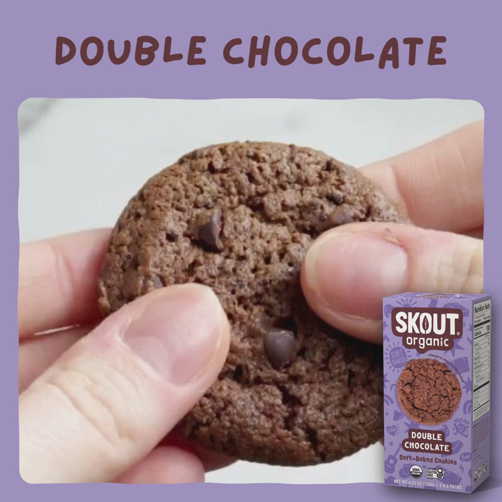 Skout Organic Double Chocolate Soft Baked Cookies - Close-up of a Double Chocolate Soft-Baked Cookie being pulled apart to show its soft, chewy interior and chocolate chips.