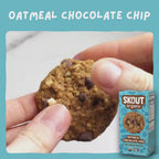 Skout Organic Oatmeal Chocolate Chip Soft Baked Cookies - Close-up of an Oatmeal Chocolate Chip Soft-Baked Cookie being pulled apart to show its soft, chewy interior and chocolate chips.