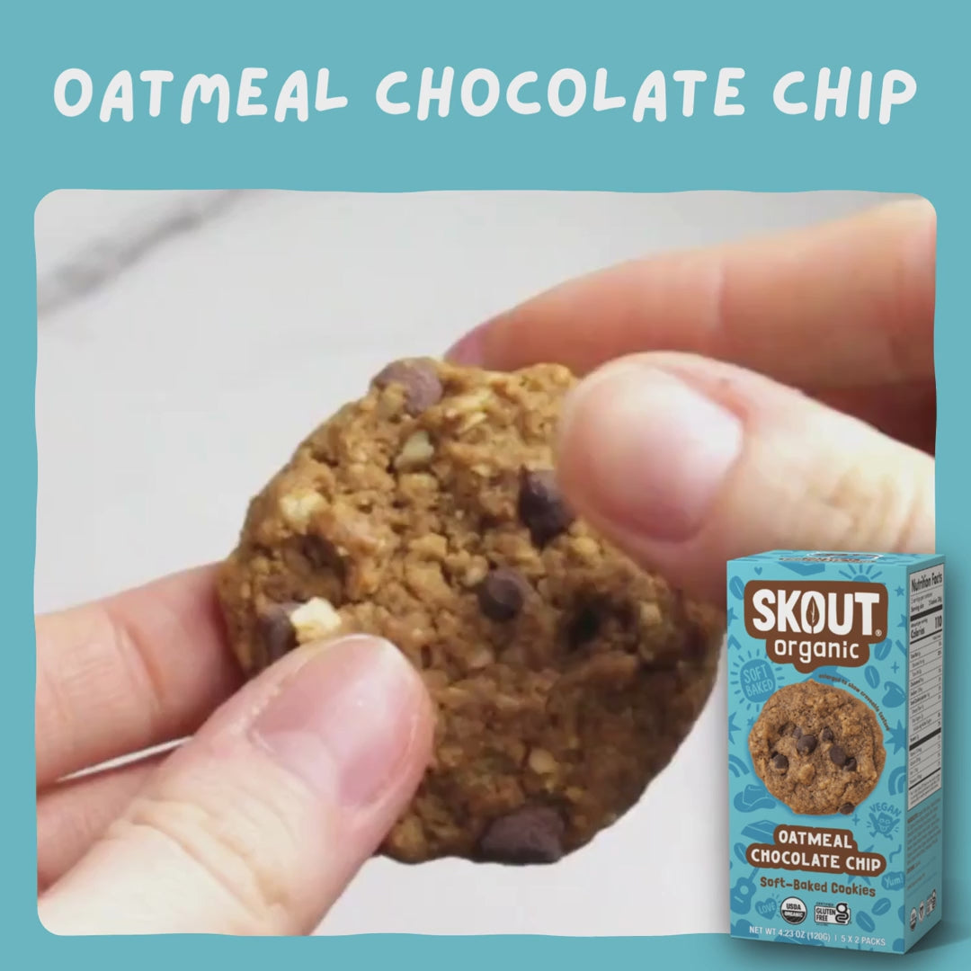 Skout Organic Oatmeal Chocolate Chip Soft Baked Cookies - Close-up of an Oatmeal Chocolate Chip Soft-Baked Cookie being pulled apart to show its soft, chewy interior and chocolate chips.